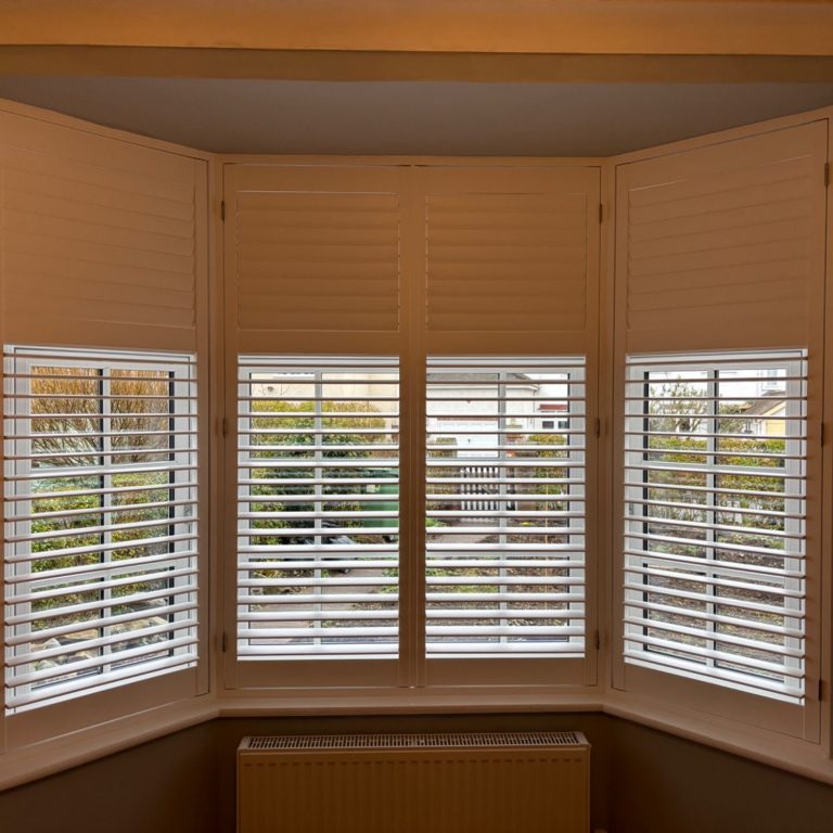 Custom made plantation shutters fitted to bay window in Newport home | Telford & Shrewsbury specialists Bay Window Shutters Ironbridge